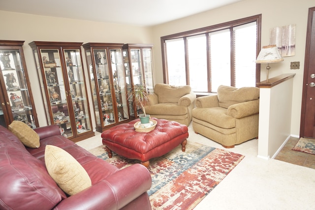 living room with carpet floors and baseboards