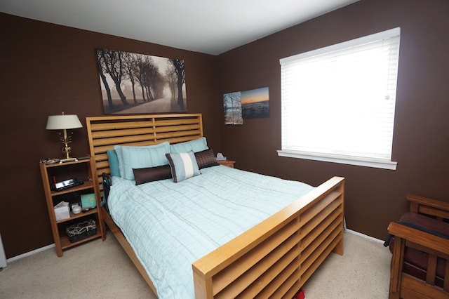 bedroom featuring carpet flooring and baseboards