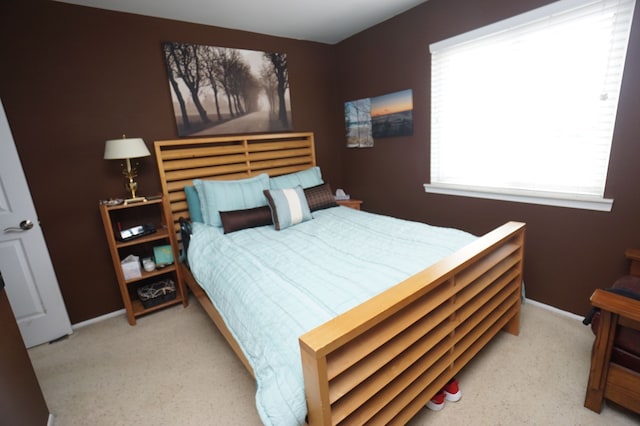 carpeted bedroom with baseboards