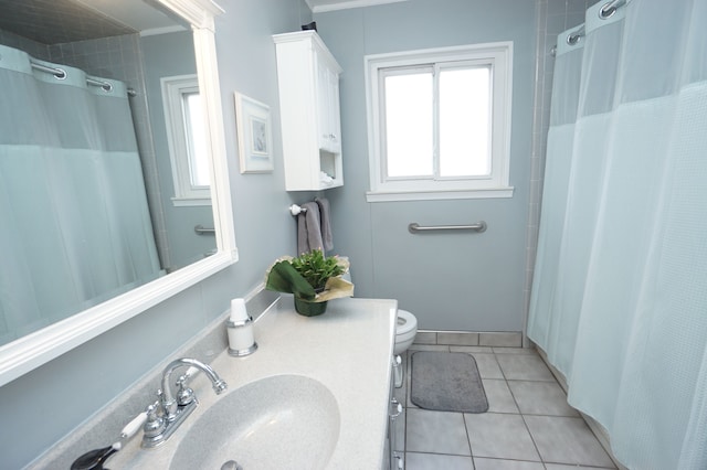 bathroom with toilet, curtained shower, vanity, and tile patterned floors