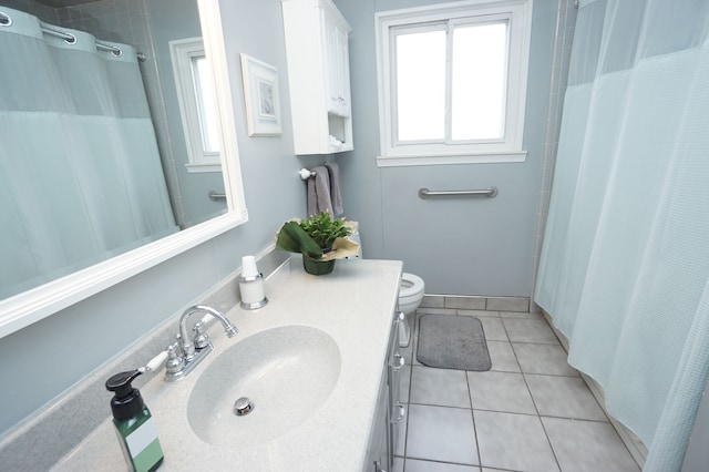 full bathroom with toilet, curtained shower, tile patterned flooring, and vanity