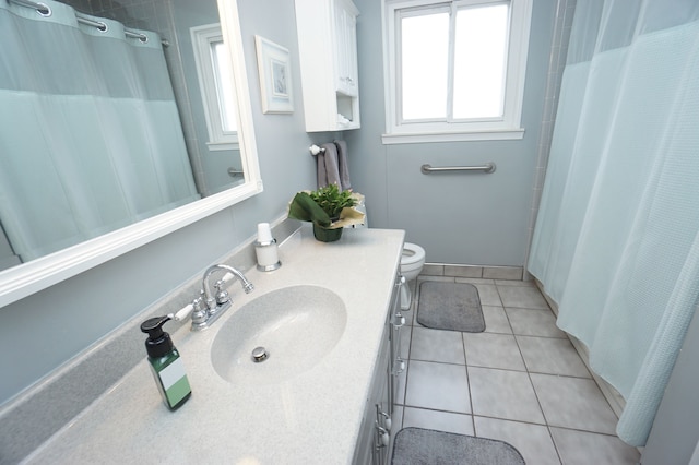 bathroom featuring toilet, a shower with curtain, tile patterned flooring, and vanity