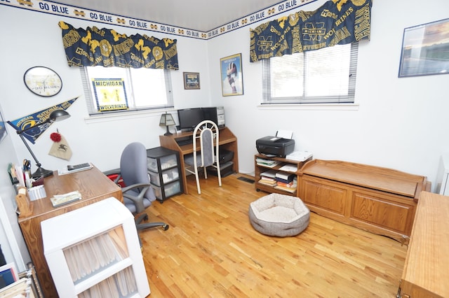 home office with wood finished floors