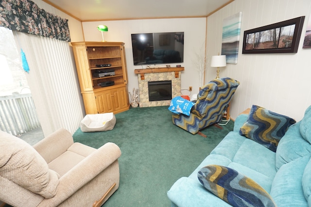 carpeted living room with ornamental molding and a fireplace