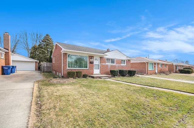 view of front of property with brick siding, a detached garage, fence, an outdoor structure, and a front lawn