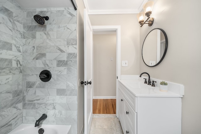 bathroom with shower / washtub combination, vanity, crown molding, and baseboards