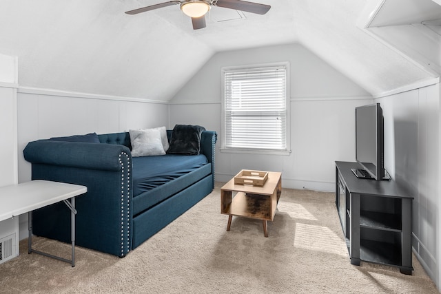 interior space with carpet, ceiling fan, and vaulted ceiling