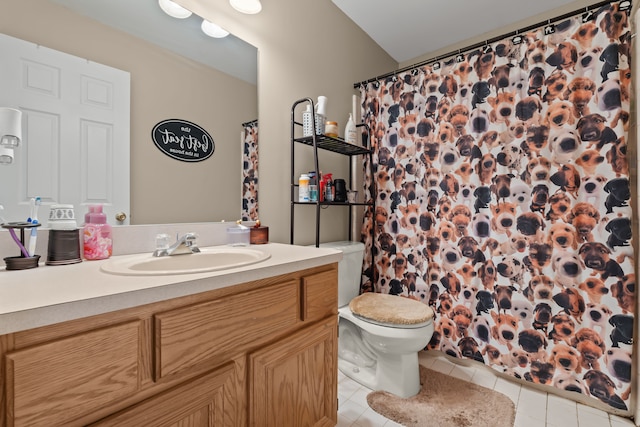 bathroom featuring tile patterned flooring, a shower with shower curtain, toilet, and vanity