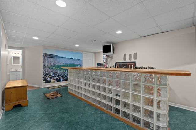 bar with recessed lighting, baseboards, and a paneled ceiling