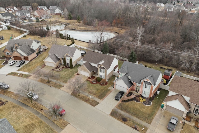 drone / aerial view with a residential view and a water view