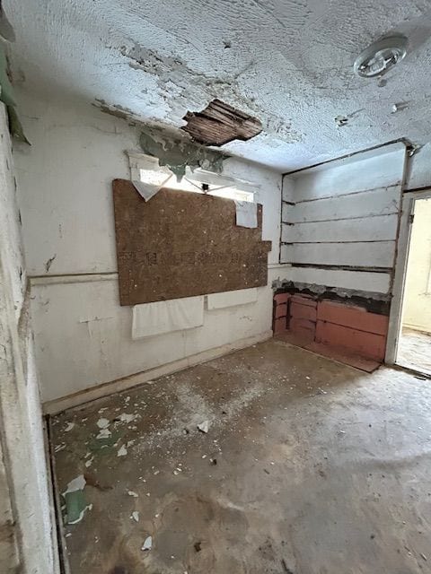 interior space with a textured ceiling