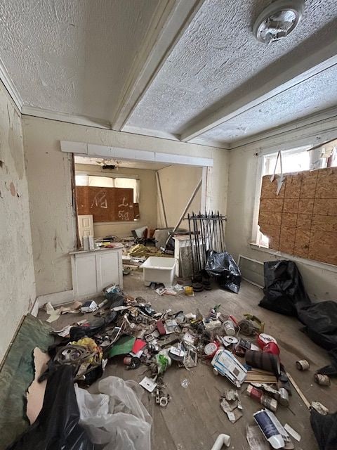 miscellaneous room with a textured ceiling