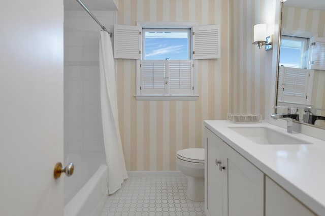 full bathroom with wallpapered walls, baseboards, toilet, shower / tub combo with curtain, and vanity