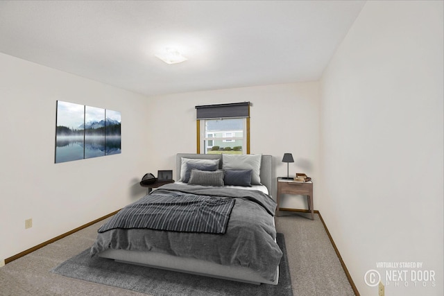 bedroom featuring carpet flooring and baseboards