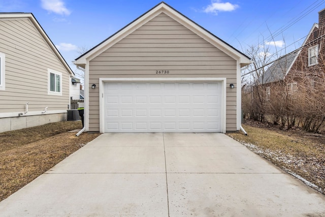 detached garage featuring central air condition unit