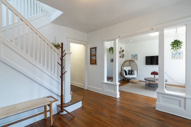 foyer entrance featuring stairs and wood finished floors