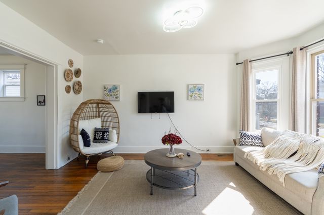 living room with wood finished floors and baseboards