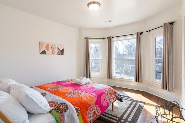 bedroom with wood finished floors