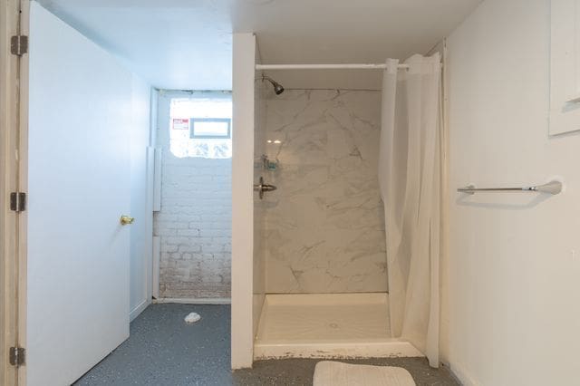 full bathroom with a shower stall