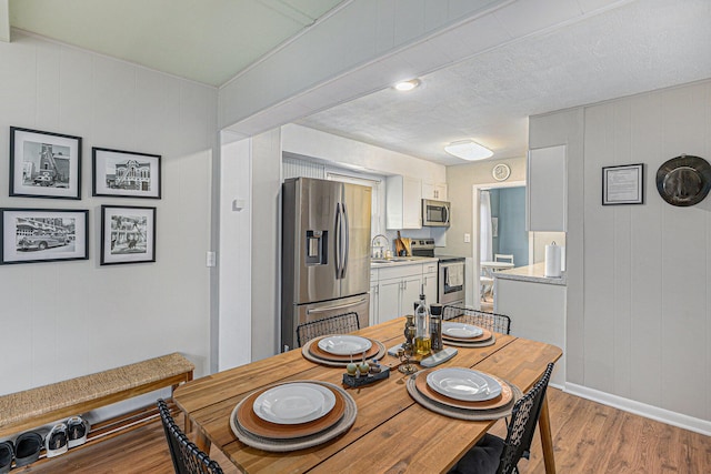 dining space featuring wood finished floors