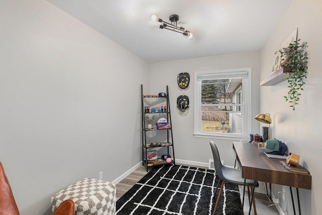 office area with wood finished floors and baseboards