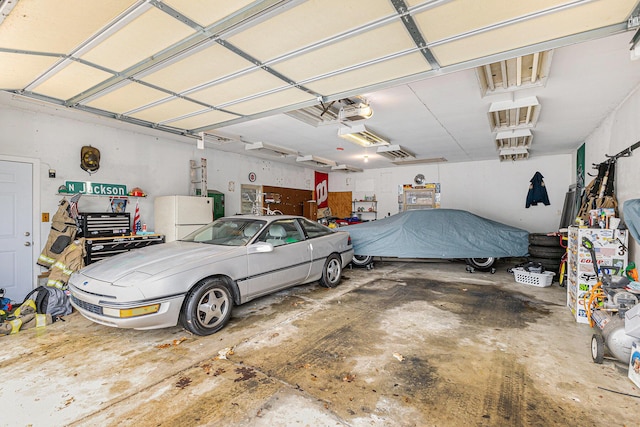 garage with freestanding refrigerator