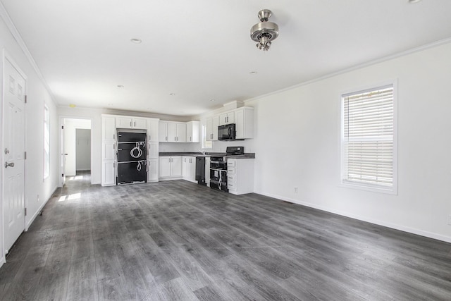 69205 Garver Lake Rd Unit 58, Edwardsburg, MI 49112 - unfurnished living room with baseboards, dark wood-style flooring, ornamental molding, and recessed lighting
