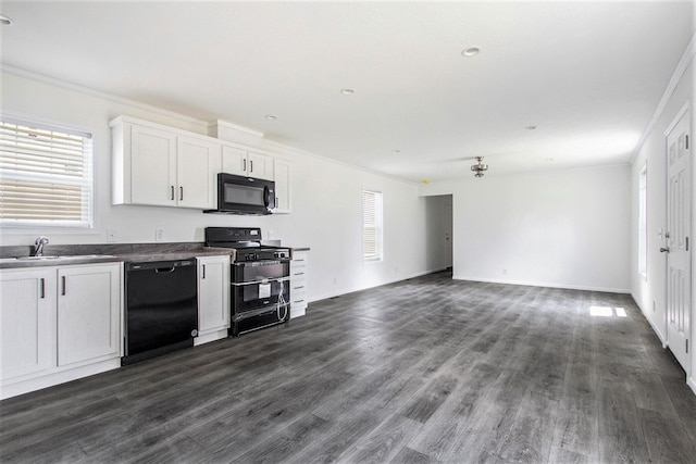 69205 Garver Lake Rd Unit 58, Edwardsburg, MI 49112 - kitchen featuring a sink, black appliances, dark countertops, and crown molding