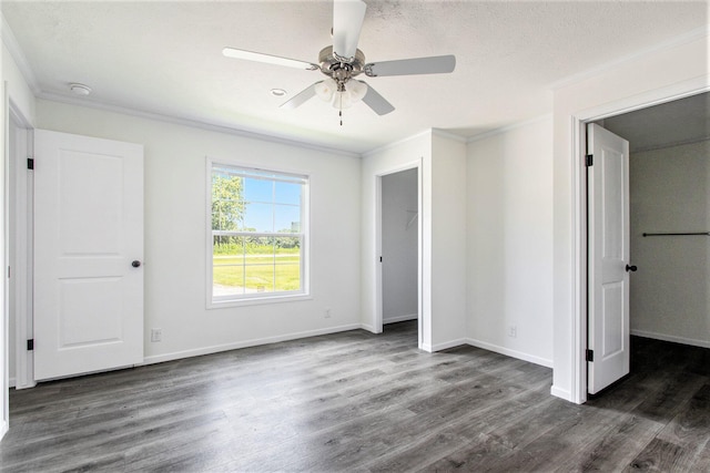 69205 Garver Lake Rd Unit 58, Edwardsburg, MI 49112 - unfurnished bedroom featuring baseboards, dark wood-style floors, and ornamental molding
