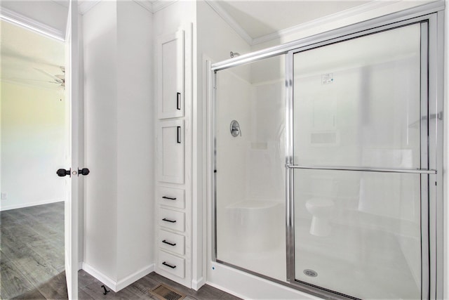 69205 Garver Lake Rd Unit 58, Edwardsburg, MI 49112 - bathroom with visible vents, a shower stall, baseboards, ornamental molding, and wood finished floors