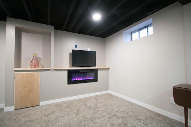 below grade area with carpet floors and baseboards