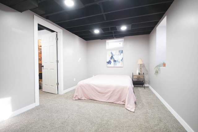 carpeted bedroom featuring visible vents and baseboards