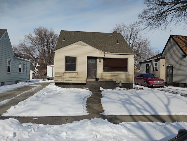 view of front of house with roof with shingles