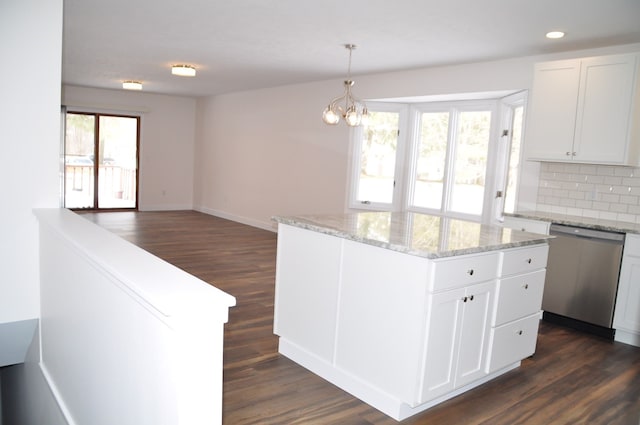 kitchen featuring dishwasher, dark wood-type flooring, backsplash, and white cabinets