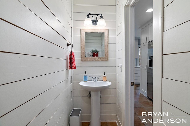 bathroom with a sink and tile patterned floors