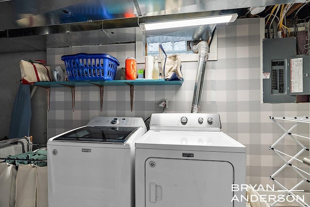 washroom with washer and dryer, laundry area, and electric panel