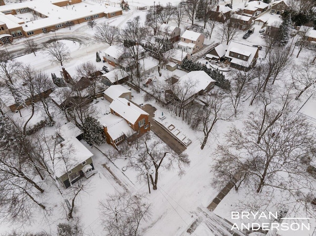 snowy aerial view featuring a residential view