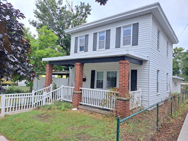 view of front facade featuring fence and a porch