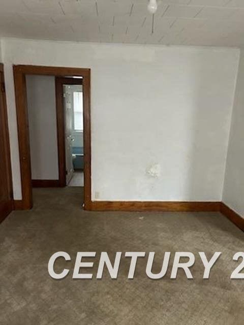 empty room with baseboards