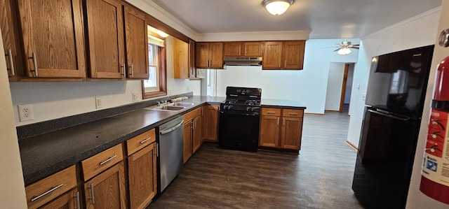 kitchen featuring dark wood-style flooring, ornamental molding, a sink, under cabinet range hood, and black appliances