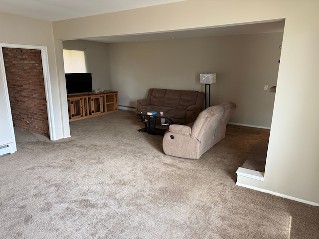living room featuring baseboards, carpet floors, and a baseboard radiator