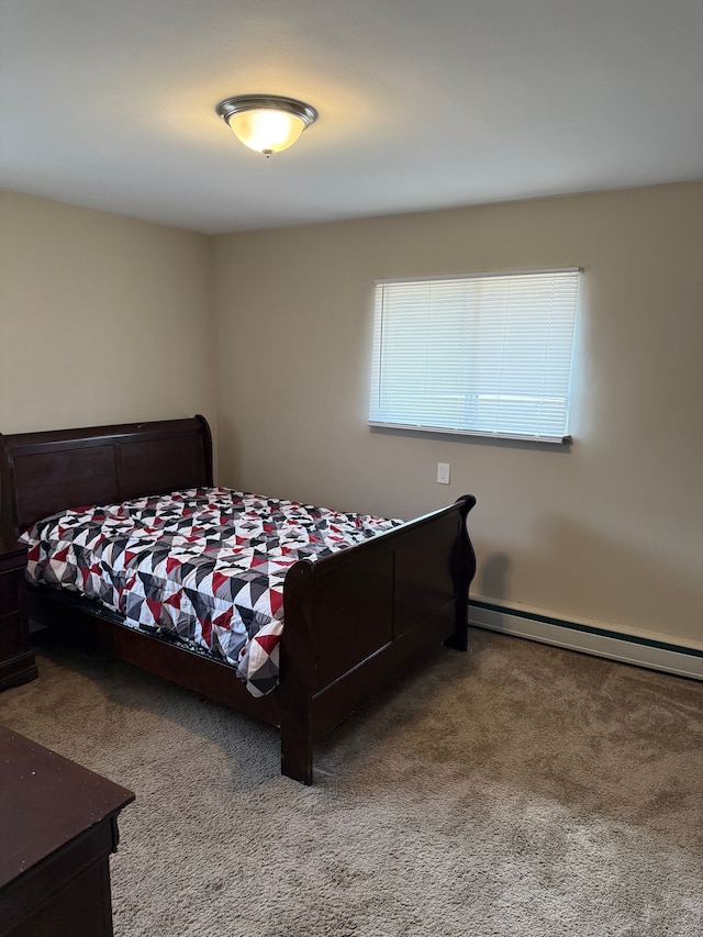 bedroom with carpet and a baseboard radiator