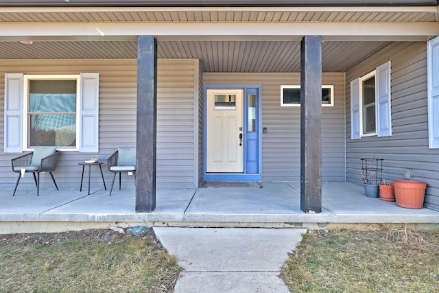 property entrance with covered porch