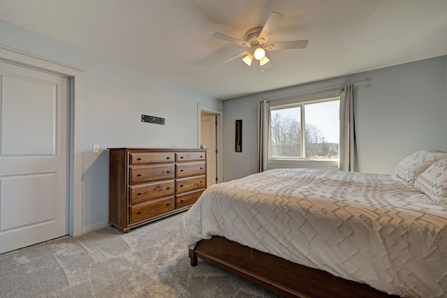 bedroom with light carpet and ceiling fan