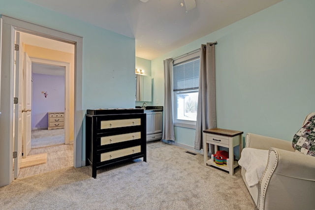 bedroom featuring a ceiling fan, carpet, and visible vents