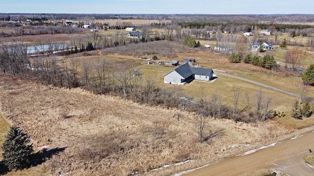 birds eye view of property with a rural view