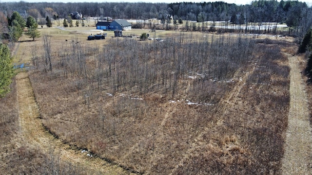 aerial view with a wooded view and a rural view