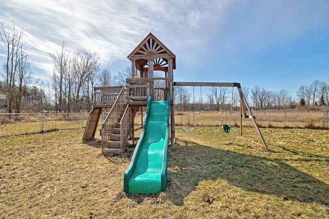 view of play area featuring a lawn and fence