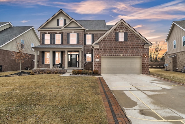 traditional-style house featuring driveway, a shingled roof, covered porch, a front lawn, and brick siding