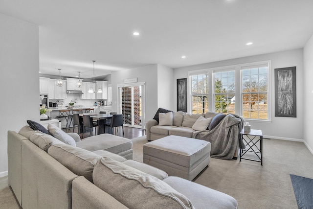 living area with baseboards and recessed lighting